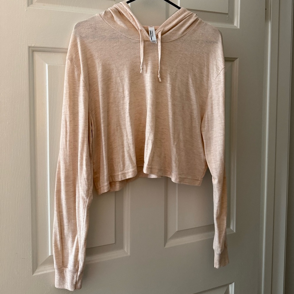 Light pink/peach cropped American Apparel long sleeve shirt with hood